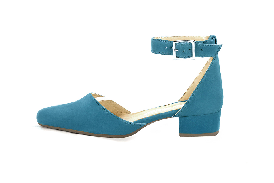 Women's peacock blue open side dress shoes, with a strap around the ankle. Round toe. Low block heels - Profile view